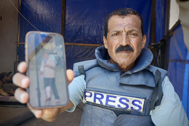 gazzede 53 yasindaki gazeteci kannan hucumlara karsin vazifesini surduruyor 12 BHwGfkai